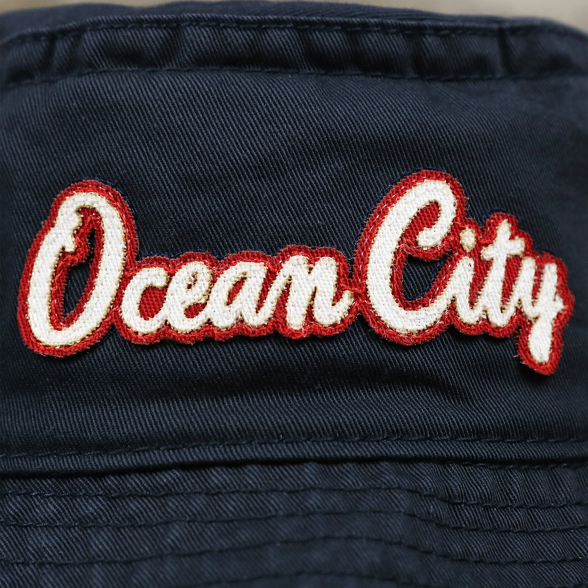 White OCNJ Double Wordmark Red Outline Bucket Hat | Navy Bucket Hat